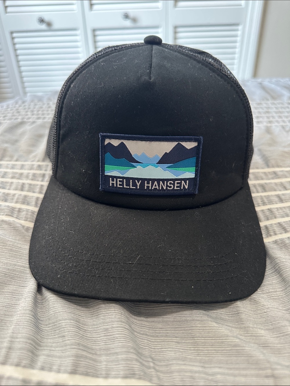 Helly Hansen Black Cap with Blue Mountain Patch SnapBack